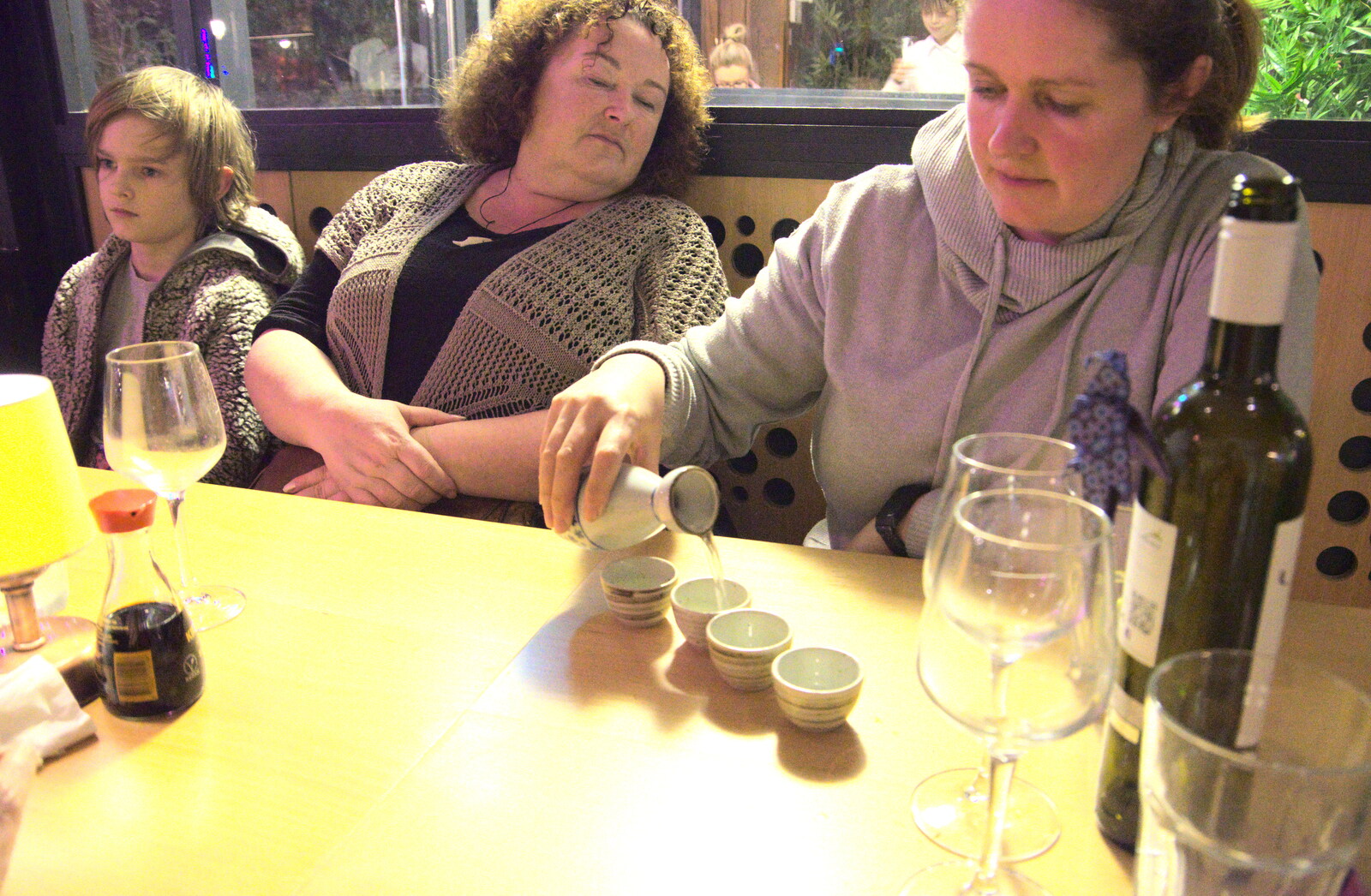 Blackrock North and Newgrange, County Louth, Ireland - 16th February 2023: Isobel pours a bit of sake