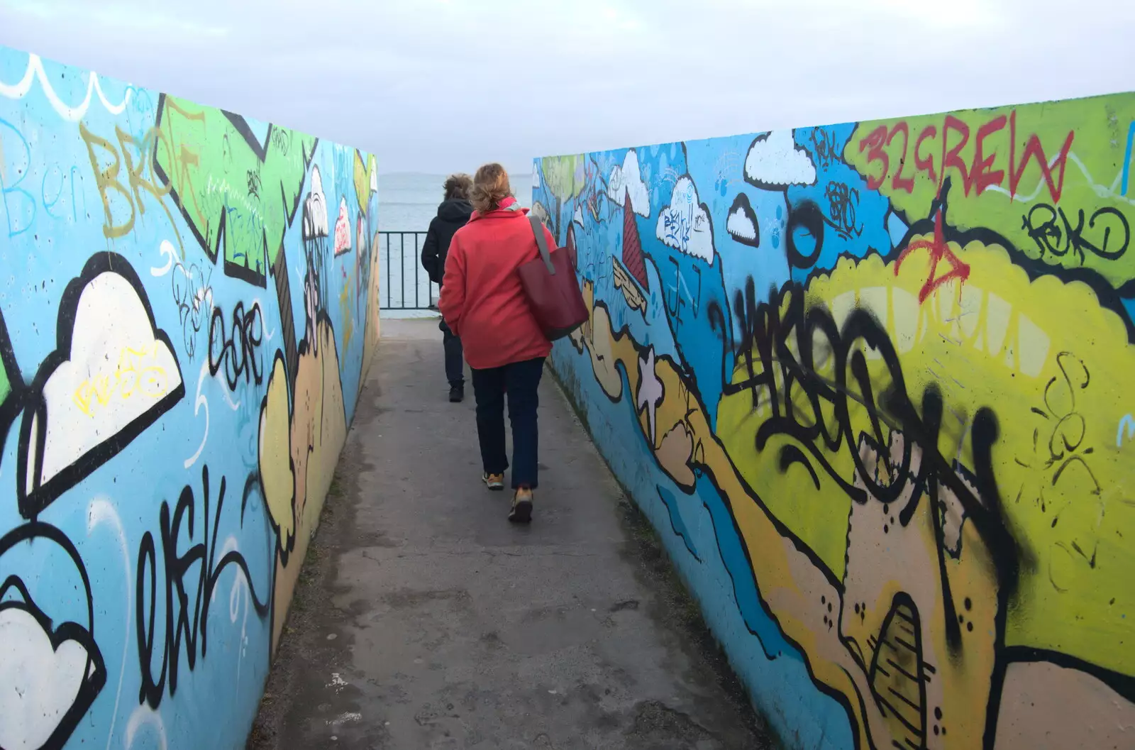 We cross over the rails on a graffiti bridge, from The Dead Zoo, Dublin, Ireland - 17th February 2023
