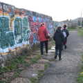 We walk past the graffiti sea wall, The Dead Zoo, Dublin, Ireland - 17th February 2023