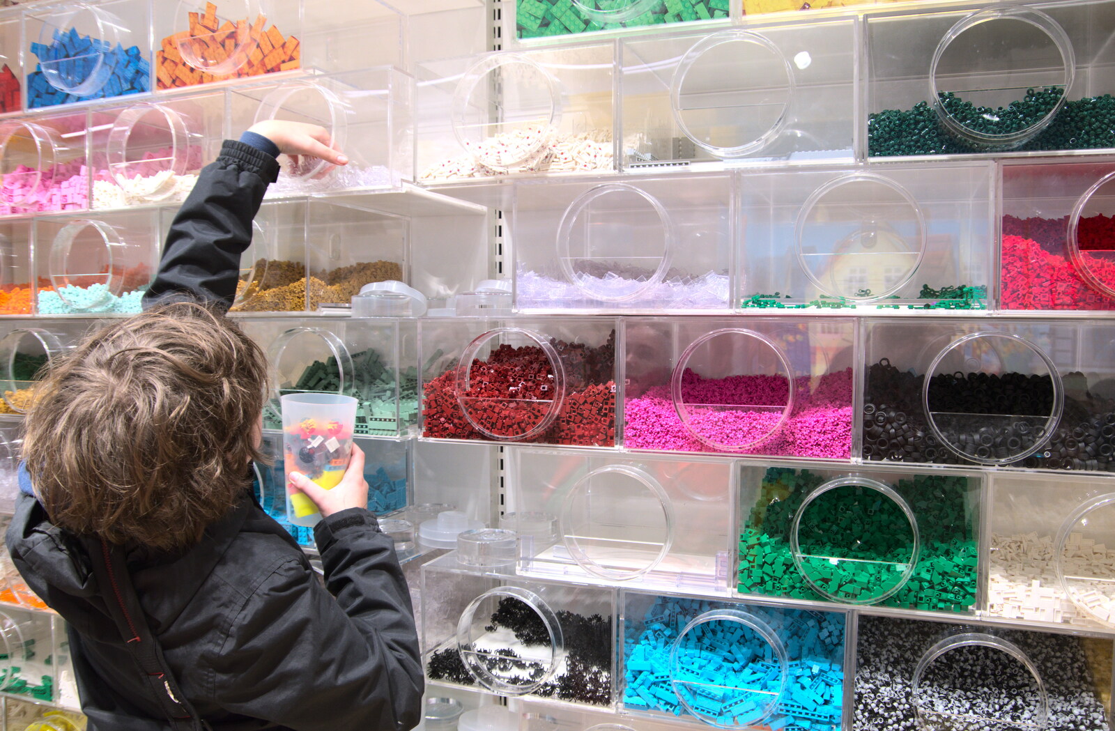The Dead Zoo, Dublin, Ireland - 17th February 2023: Fred loads up a pick'n'mix Lego tub, for €19
