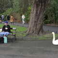 A swan sits on the path in St. Stephen's Green, The Dead Zoo, Dublin, Ireland - 17th February 2023