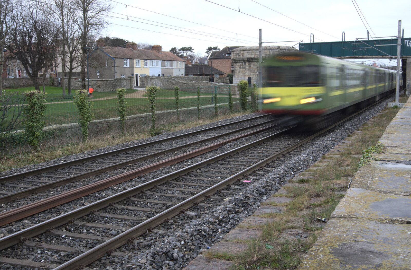 The End of the Breffni, Blackrock, Dublin - 18th February 2023: A DART train rumbles past