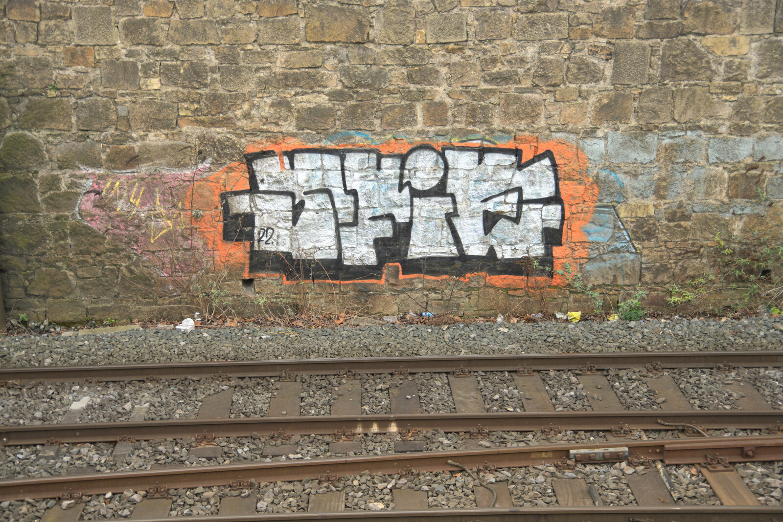 The End of the Breffni, Blackrock, Dublin - 18th February 2023: A funky graffiti tag on the DART wall