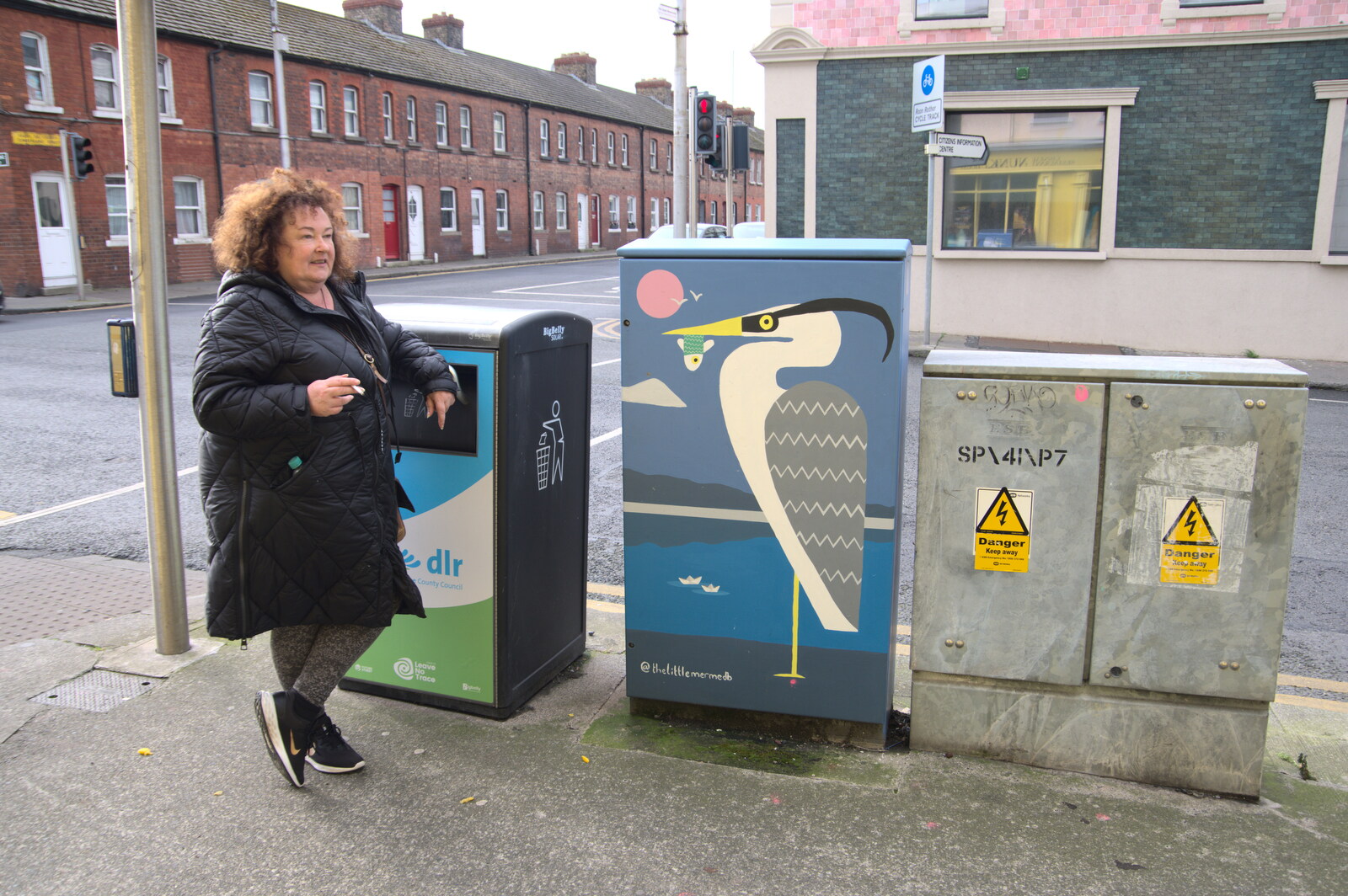 The End of the Breffni, Blackrock, Dublin - 18th February 2023: Da Wheeze has a smoke by a heron mural