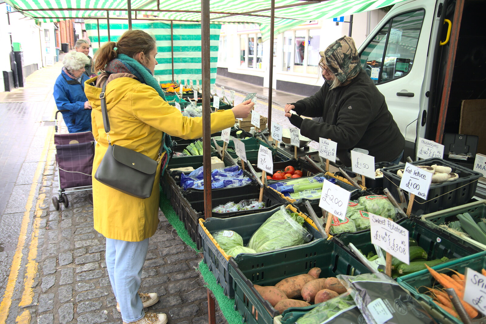 Lunch in Harleston, Norfolk - 1st March 2023: Isobel buys some veg off the market