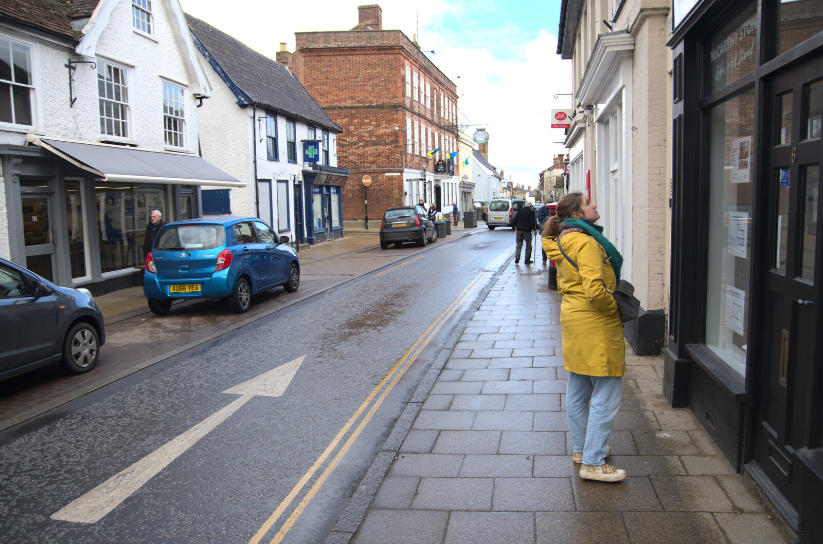 Lunch in Harleston, Norfolk - 1st March 2023: Isobel peers into a shop window