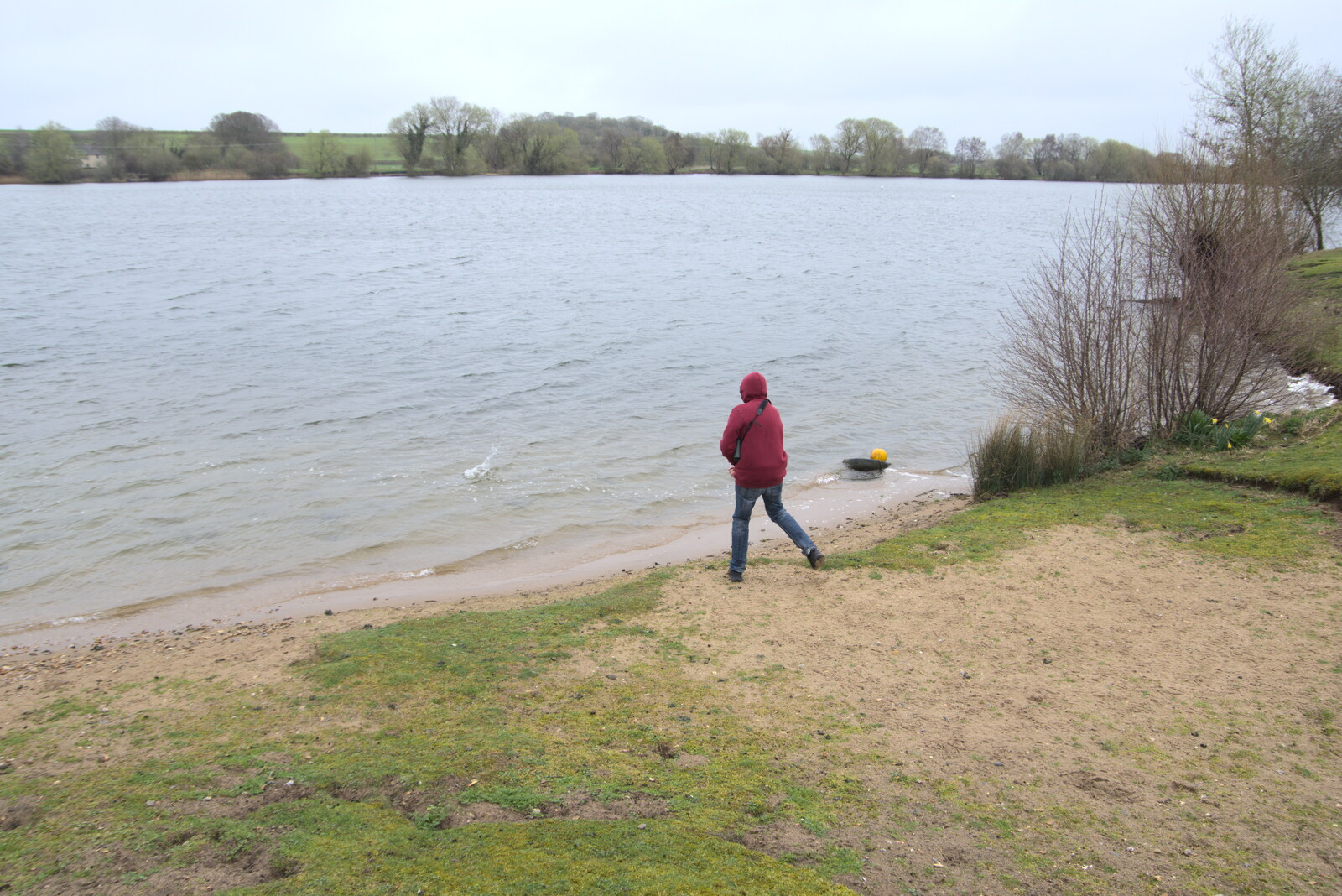 Fred flings stones into the lake from A Day in New Milton, Hampshire - 3rd April 2023