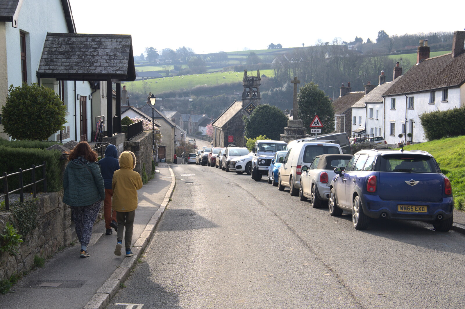 We walk down the main road through the village from Easter in South Zeal and Moretonhampstead, Devon - 9th April