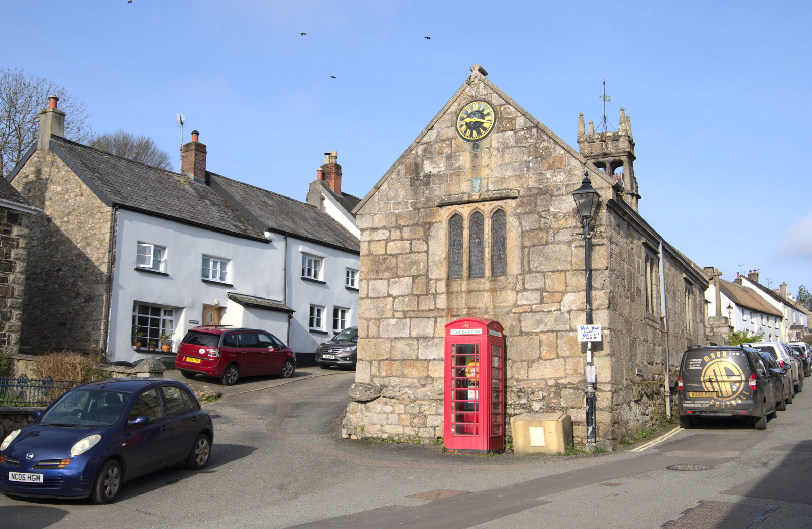 K6 phonebox and the chapel of St. Mary from Easter in South Zeal and Moretonhampstead, Devon - 9th April