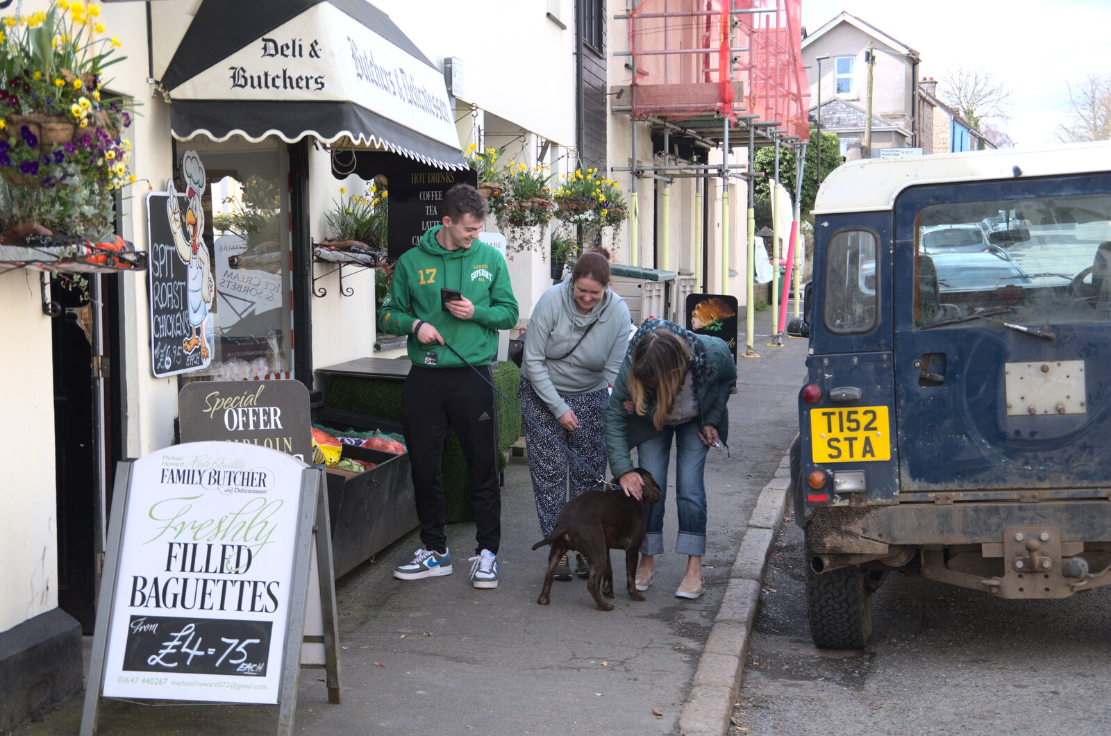 Grandma J says hi to a dog outside the butcher's from Easter in South Zeal and Moretonhampstead, Devon - 9th April