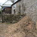 A pile of animal bedding by a cottage, Easter in South Zeal and Moretonhampstead, Devon - 9th April