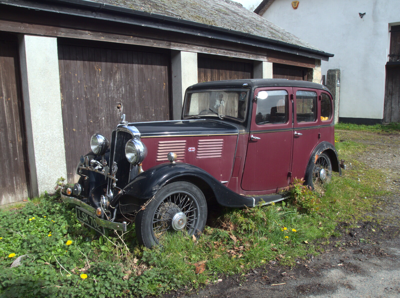 A classic car rots in the street, intestate from Chilli Farms, Okehampton and the Oxenham Arms, South Zeal, Devon - 10th April 2023