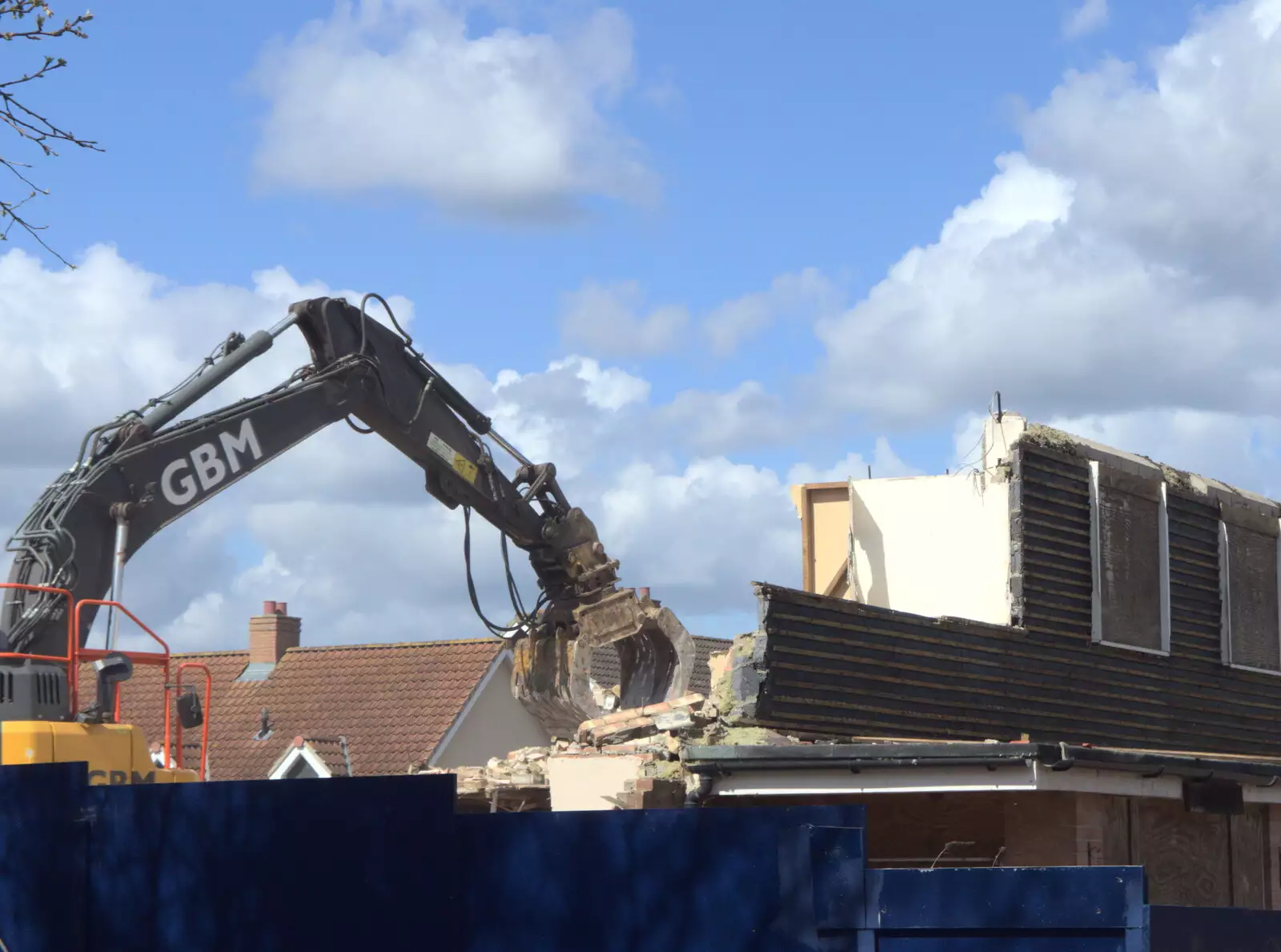 A digger grabs at another bit of building, from Paddock House Demolition and the BSCC at Thorndon, Suffolk - 13th April 2023