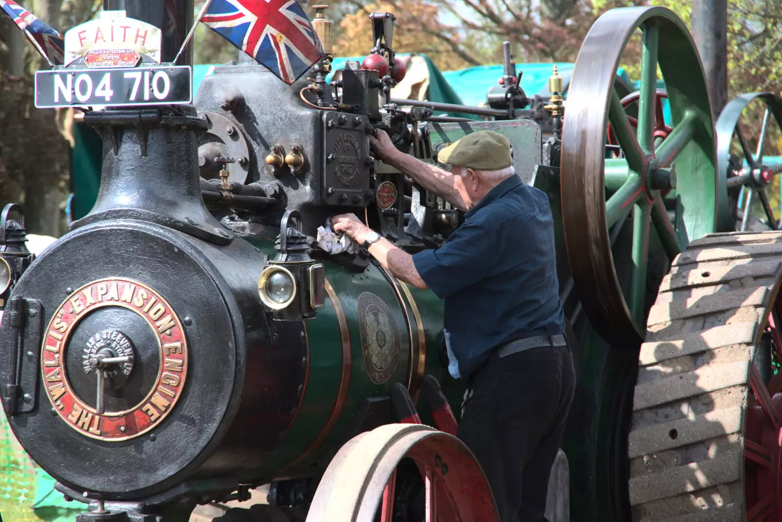 A dude tends to his Ransome's, Simms and Jeffries, from The Heritage Steam Gala, Bressingham Steam Museum, Norfolk - 1st May 2023