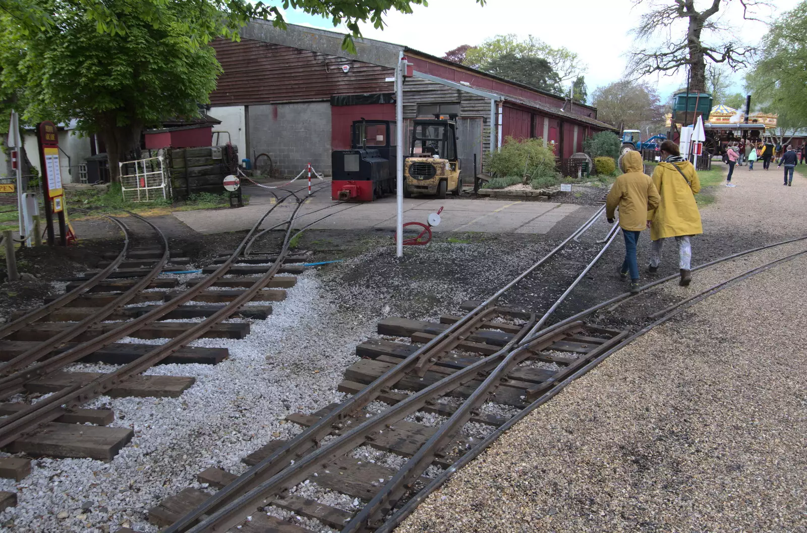 Harry and Isobel cross the tracks, from The Heritage Steam Gala, Bressingham Steam Museum, Norfolk - 1st May 2023