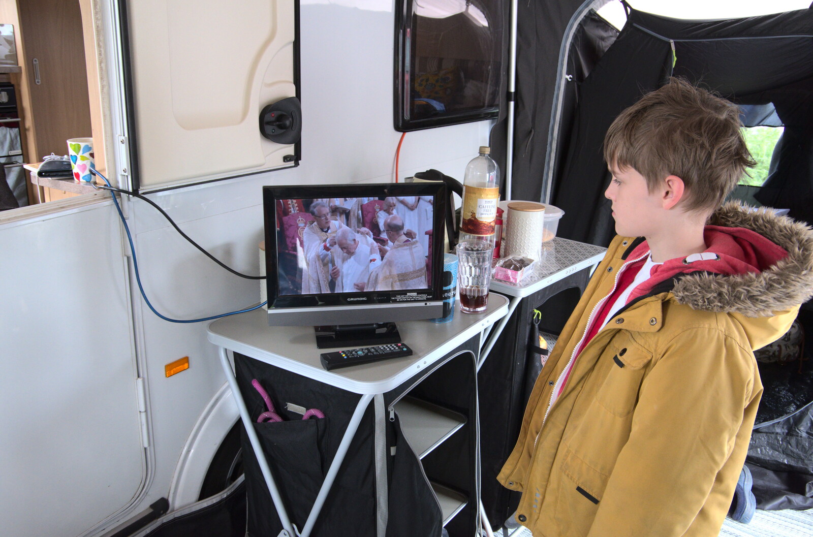 Harry watches on the caravan's tiny TV from A Coronation Camping Picnic, Kelling Heath, Norfolk - 6th May 2023