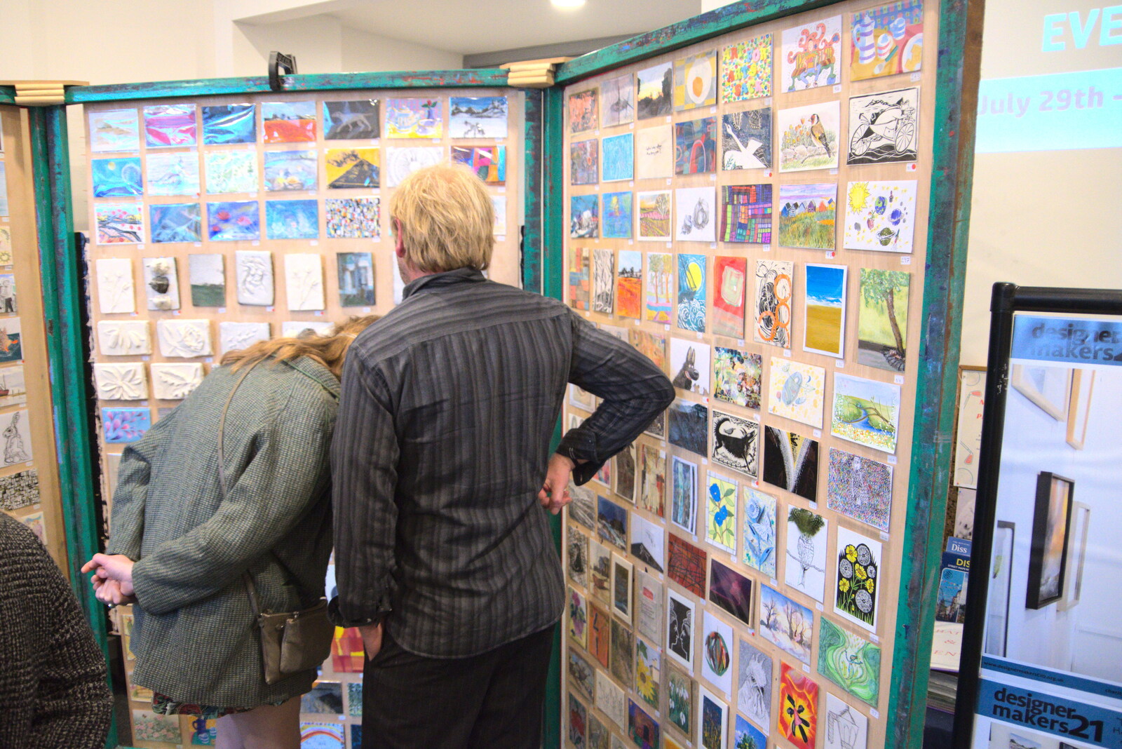 Allyson and Pete look at arty postcards from DesignerMakers' Fund-Raising Ceilidh, The Cornhall, Diss - 13th May 2023