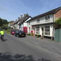 Isobel cycles up Low Street in Hoxne, A Quest for the Fabled Swimming Spot, Hoxne, Suffolk - 29th May 2023