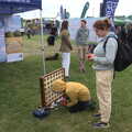 Harry and Isobel stop for a game of Connect 4, The Suffolk Youth Wind Orchestra at the Suffolk Show, Trinity Park - 1st June 2023
