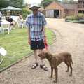 Apple John hangs around with a dog, BSCC Rides and the Village Fete, Brome, Suffolk - 8th July 2023