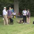 An announcement is made after the dog race, BSCC Rides and the Village Fete, Brome, Suffolk - 8th July 2023