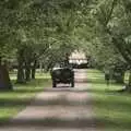 The Jeep trundles off up Brome Hall's drive, BSCC Rides and the Village Fete, Brome, Suffolk - 8th July 2023