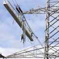 Someone dangles on a ladder by the insulators, National Grid Pylon Upgrades, Thrandeston, Suffolk - 30th July 2023