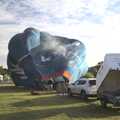 The KLM balloon is actually smoking as it burns, The Old Buckenham Not Air Balloon Festival, Norfolk - 13th August 2023