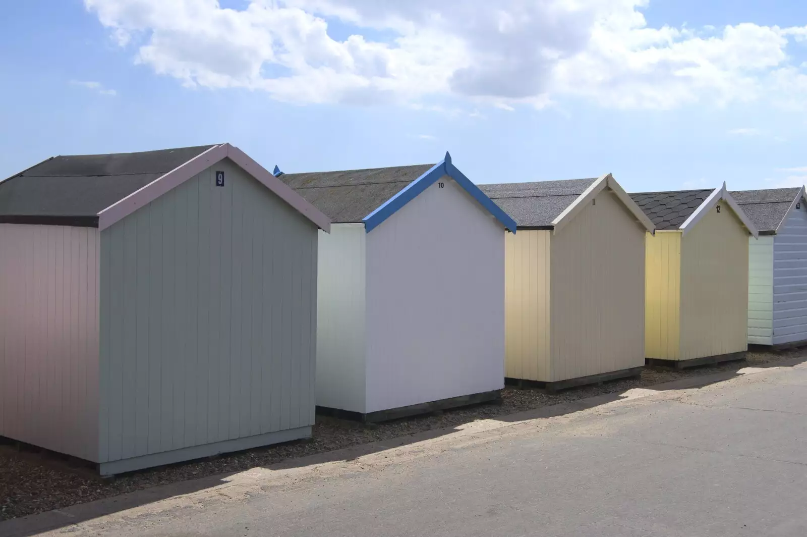 Pastel-shaded beach huts on the undercliff, from A trip on the Ferris Wheel, Felixstowe, Suffolk - 15th August 2023