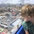 Harry looks down nervously, A trip on the Ferris Wheel, Felixstowe, Suffolk - 15th August 2023