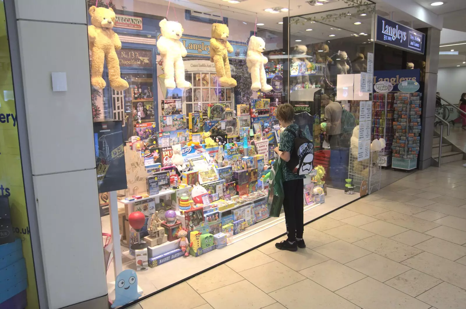 Harry peers longingly into Langley's window, from Shoe Shopping in Norwich, Norfolk - 16th August 2023