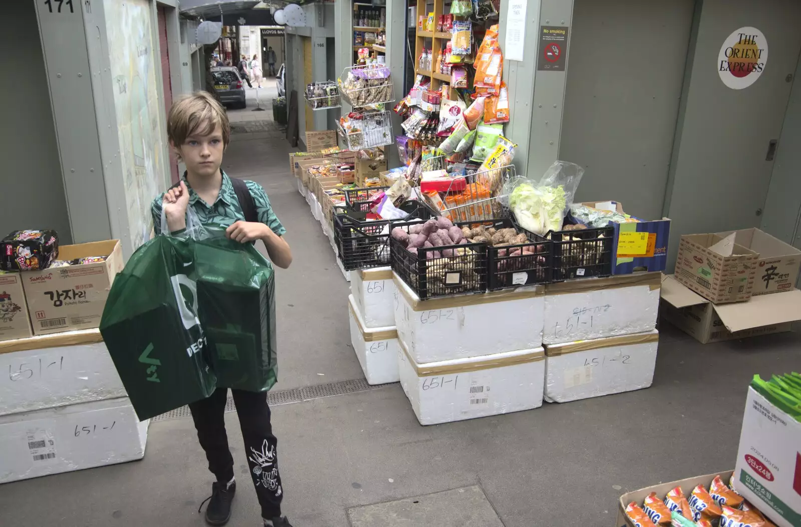 Harry holds his bag of shoes in the market lanes, from Shoe Shopping in Norwich, Norfolk - 16th August 2023