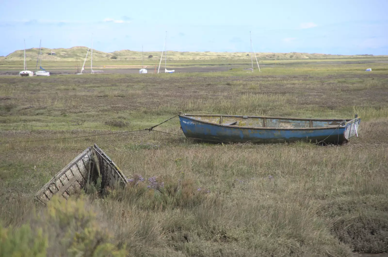 A boat's bow lurches out of the marshes, from Camping on the Edge at Snettisham Beach, Norfolk - 28th August 2023