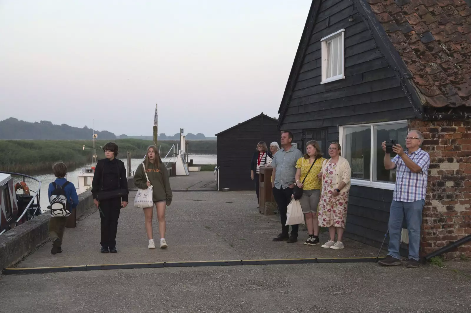 There's a small crowd watching the starlings , from Fred and the SYWO at Snape Maltings, Snape, Suffolk - 3rd September 2023