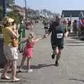 A runner gets a High Five, A Postcard From Felixstowe Ferry, Suffolk - 10th September 2023