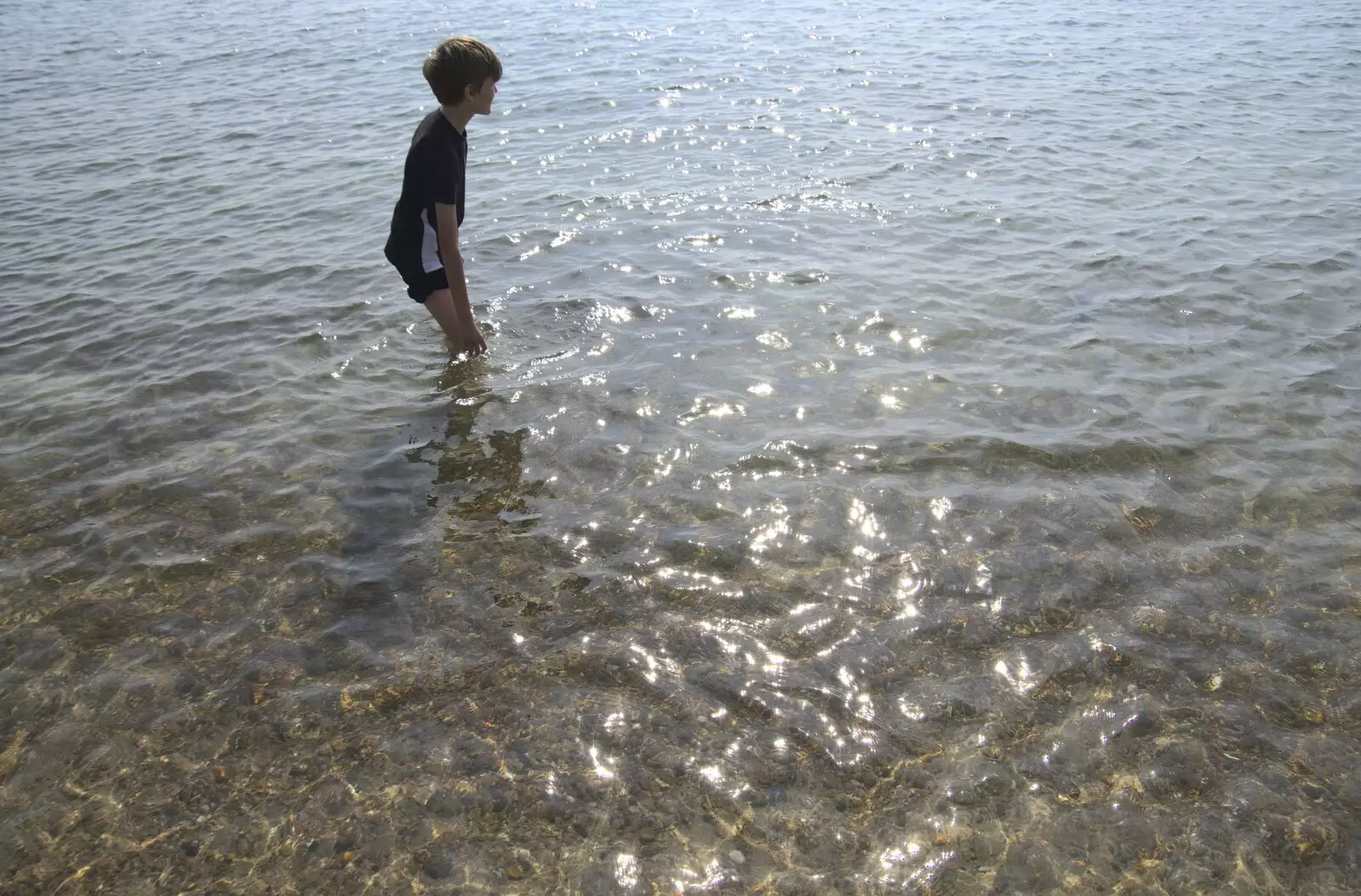 Harry paddles in the crystal-clear sea, from A Postcard From Felixstowe Ferry, Suffolk - 10th September 2023