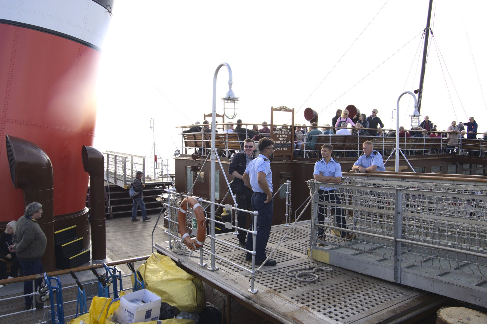 Crew hang around on the gangway from The Waverley Paddle Steamer at Southwold Pier, Suffolk - 27th September 2023
