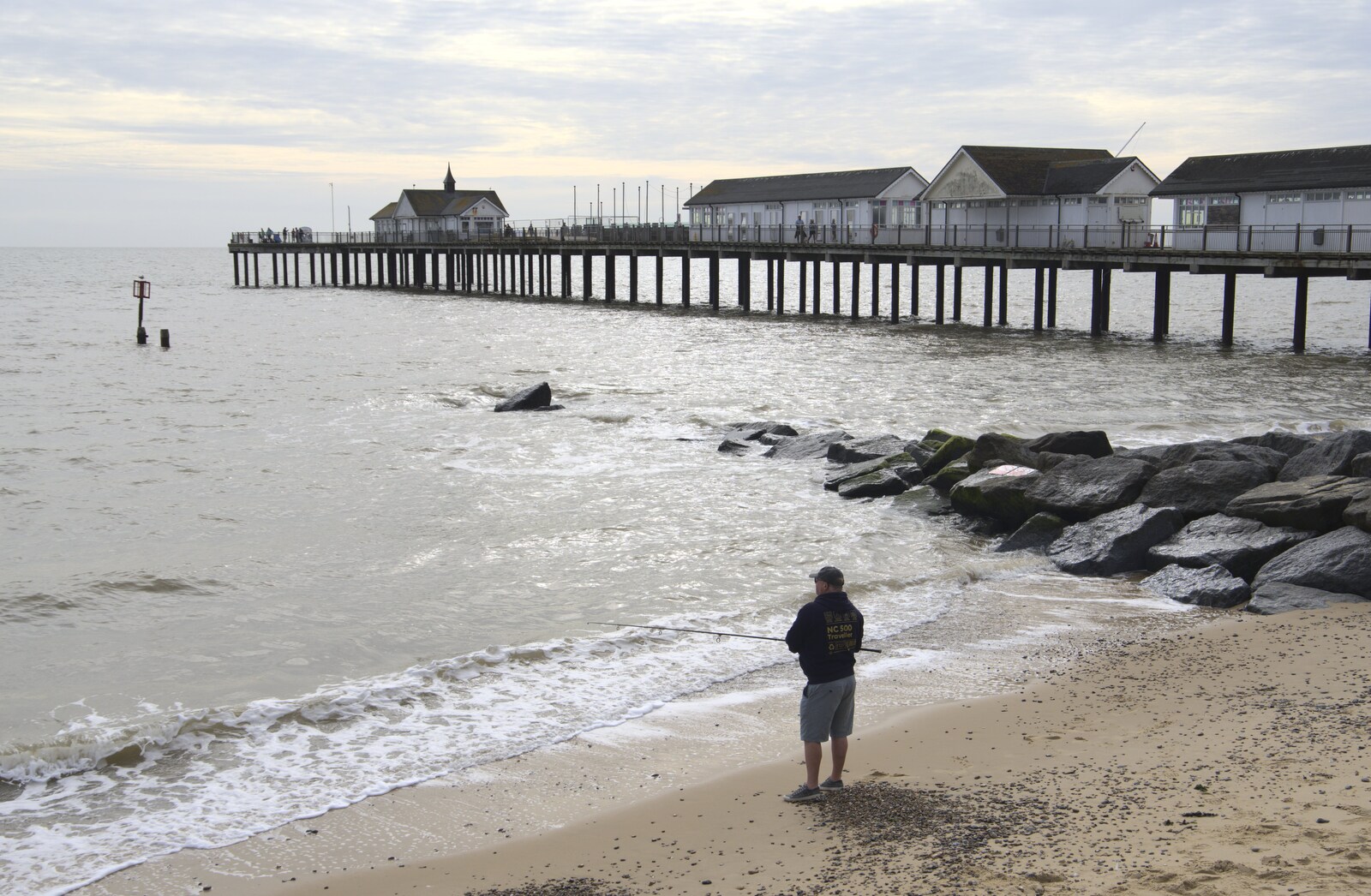 Some dude does a bit of fishing by the pier from The Waverley Paddle Steamer at Southwold Pier, Suffolk - 27th September 2023