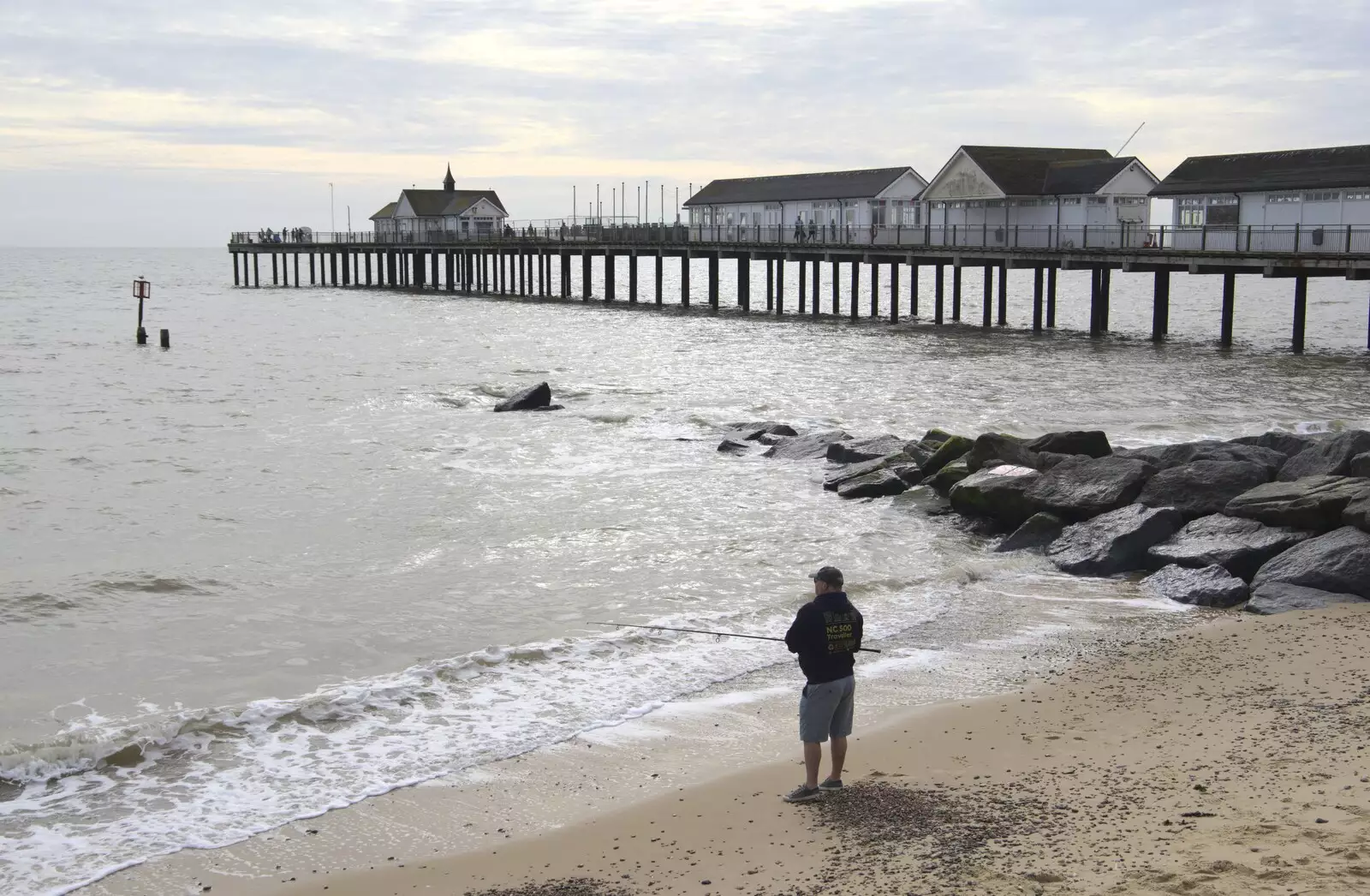 Some dude does a bit of fishing by the pier, from The Waverley Paddle Steamer at Southwold Pier, Suffolk - 27th September 2023