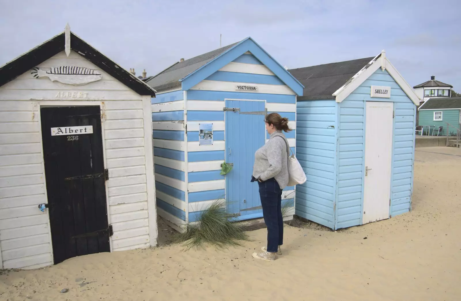 Isobel looks at some royal-named beach huts, from The Waverley Paddle Steamer at Southwold Pier, Suffolk - 27th September 2023