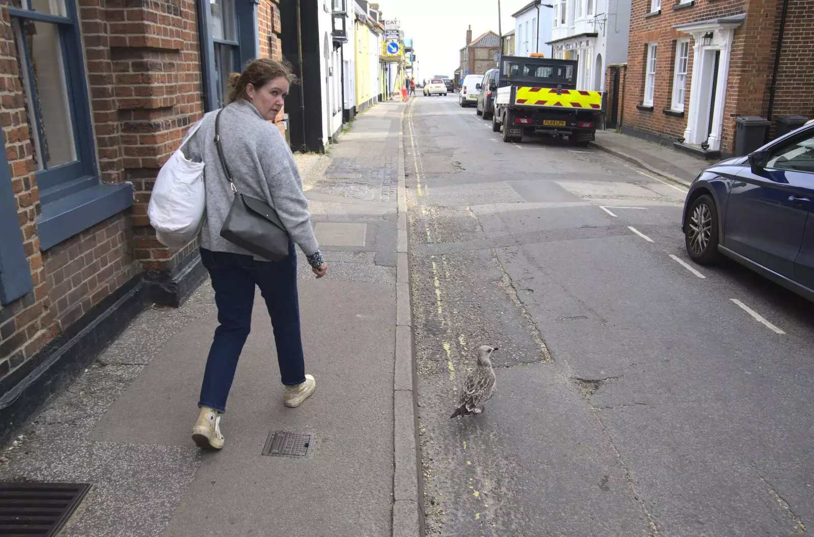 Isobel looks at a very bold juvenile herring gull, from The Waverley Paddle Steamer at Southwold Pier, Suffolk - 27th September 2023