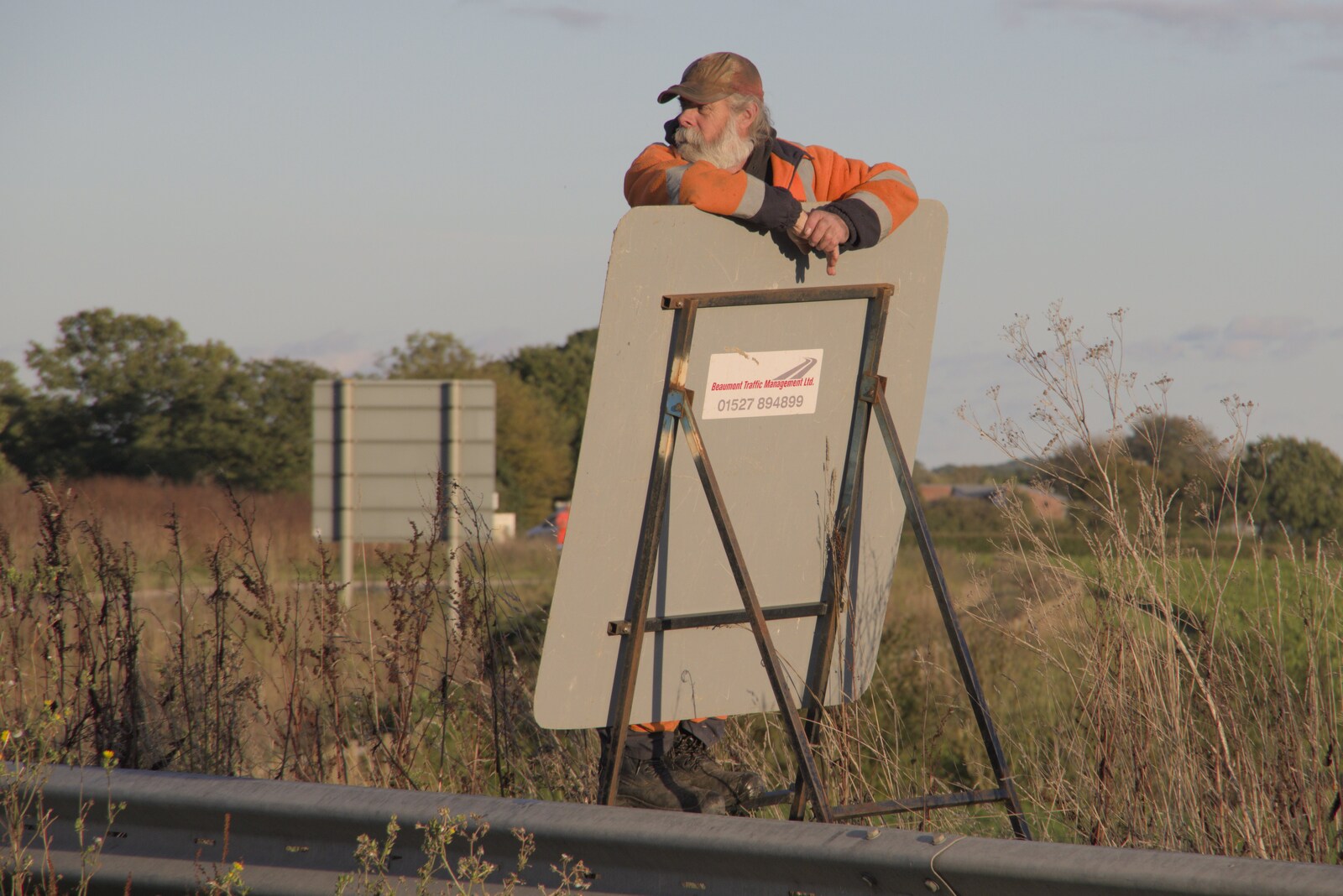 Some dude hangs off a road-closure sign from A Giant Load on the A140, Yaxley, Suffolk - 22nd October 2023