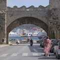 The Virgin cruise ship lurks behind a city gate, The Cats of Rhodes, Ρόδος, Greece - 24th October 2023