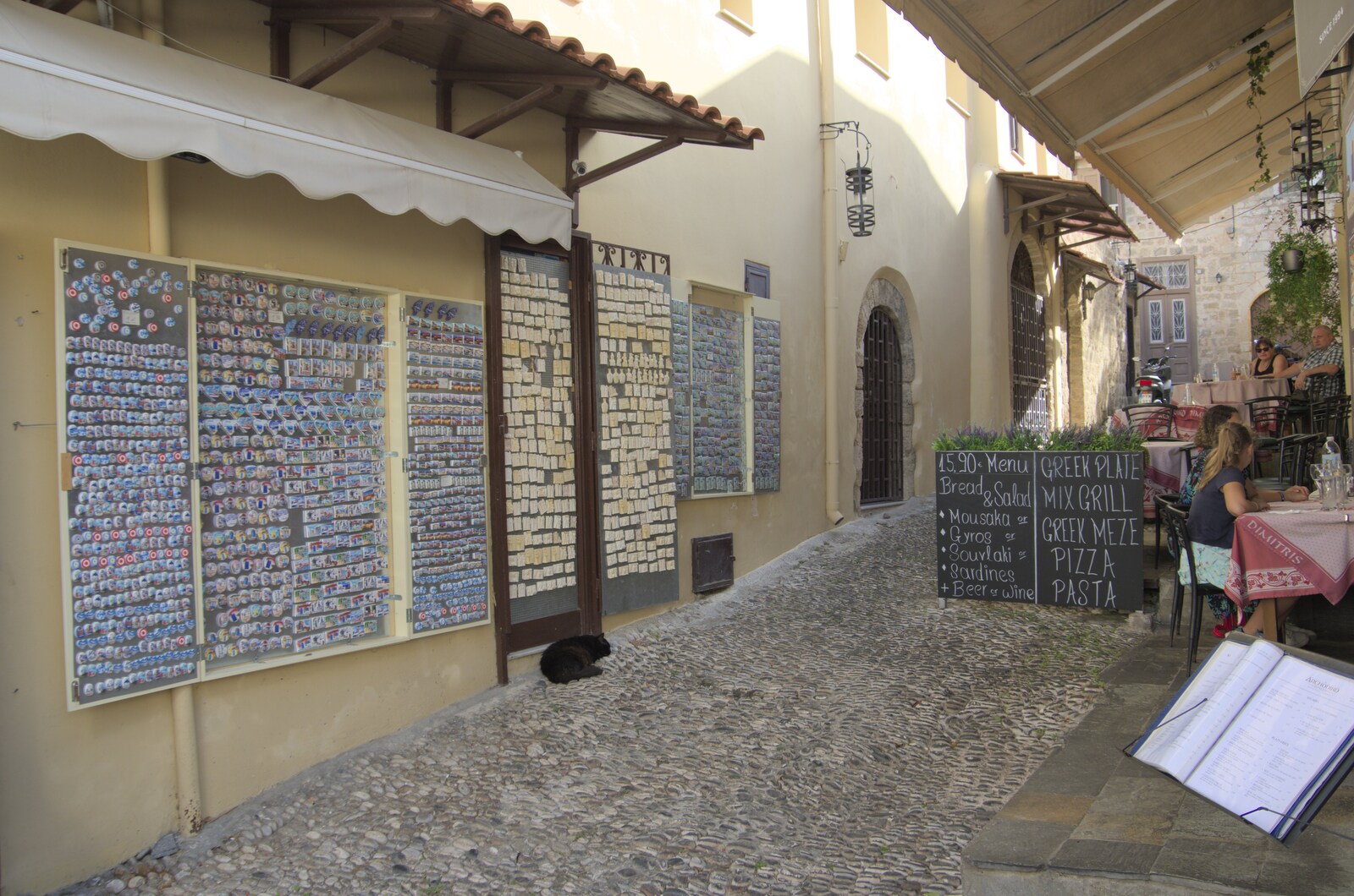 There's a wall of fridge magnets on a side street from The Cats of Rhodes, Ρόδος, Greece - 24th October 2023