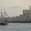 The pirate ship sails around Fort of St. Nicholas, The Cats of Rhodes, Ρόδος, Greece - 24th October 2023