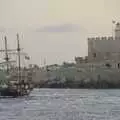 The pirate ship sails around Fort of St. Nicholas, The Cats of Rhodes, Ρόδος, Greece - 24th October 2023