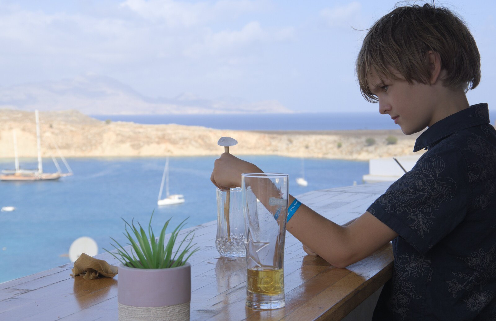 Harry plays around with his ice from A Trip to Lindos and More Cats of Rhodes, Ρόδος και Λίνδος, Greece - 28th October 2023