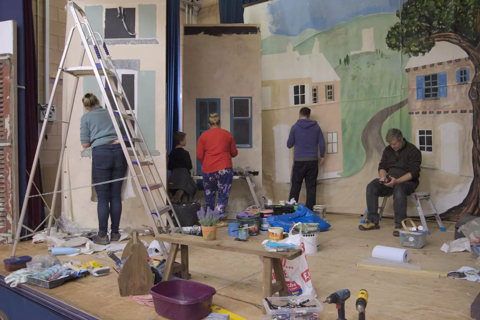 The stage is busy with painting, from Painting the Set at the Village Hall, Garboldisham, Norfolk - 8th November 2023