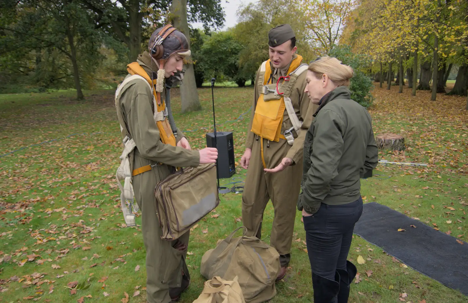 The re-enactors talk someone through their gear, from A B-17 Memorial, The Oaksmere Hotel, Brome, Suffolk - 10th November 2023