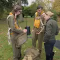 The re-enactors talk someone through their gear, A B-17 Memorial, The Oaksmere Hotel, Brome, Suffolk - 10th November 2023